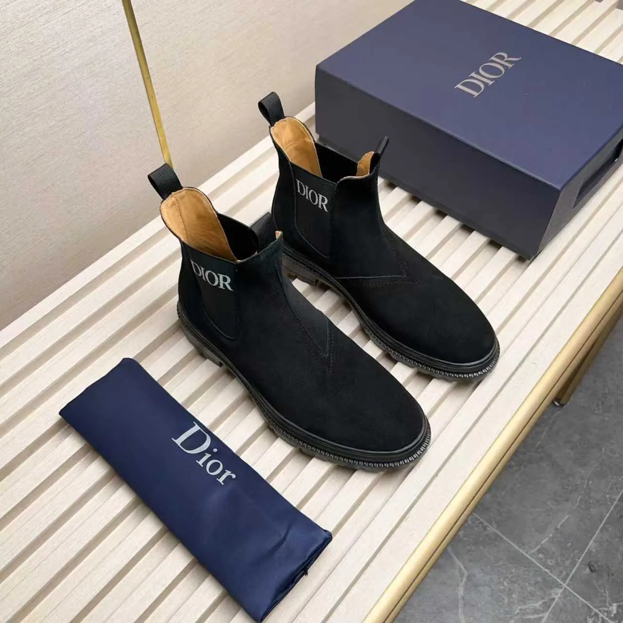 Men's Shoes 💰480 Dior A practical choice that combines protection with classic style. Made from durable Rugged Calf leather, it's tumbled and hand-finished to create a soft suede feel with a rich texture. Elastic side panels and subtle cutouts are inspired by the classic Chelsea boot. Leather upper and lining with Kummel tabs at front and rear, rubber outsole